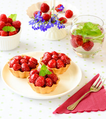 Mini tarts with raspberries fruits