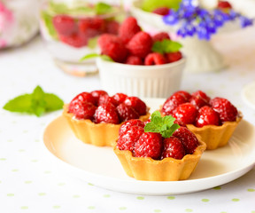 Mini tarts with raspberries fruits
