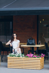 Girl with long hair in elegant white dress