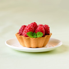 Mini tart with raspberries fruits