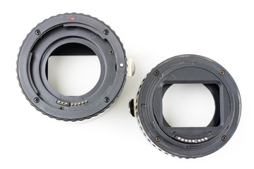 Intermediate ring for macro photography on a white table. Photo accessories for photographic...