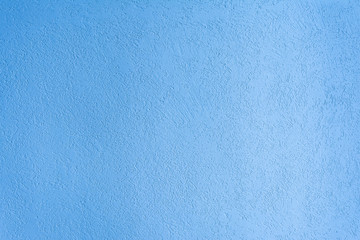 texture of the surface of the wall covered with decorative plaster of the woodworm type