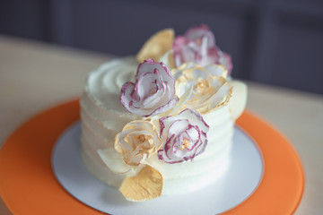 White sponge cake on wooden bright table