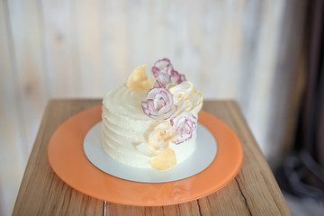 White sponge cake on wooden bright table