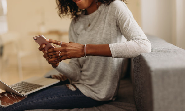 Businesswoman working from home on laptop