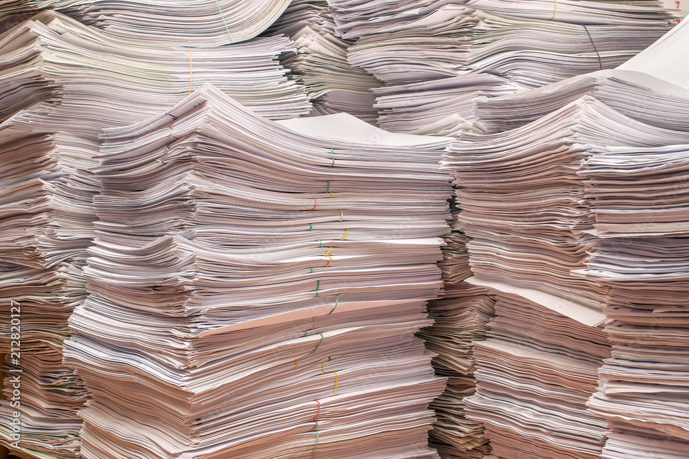 Wall mural pile of paper documents in the office