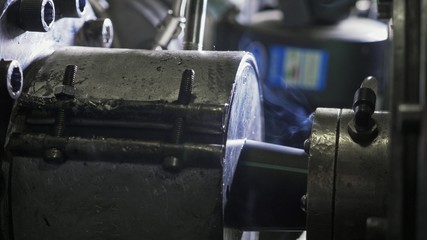 Pipes manufacturing production line. Manufacture of plastic water pipes of the factory. Process of making plastic tubes on the machine tool with the use of water and air pressure.