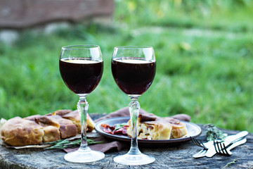 Red wine and light snacks, Grapes, wine, cheese, pie.