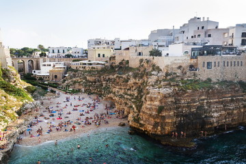 People swimming on lovely beach Lama Monachile in Polignano a Mare, Adriatic Sea, Apulia, Bari province, Italy, Europe © josefkubes