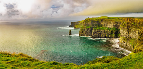 Beautifull wild landscape of Cliffs of Moher in Ireland. Hiking trip on summer holidays.  - obrazy, fototapety, plakaty