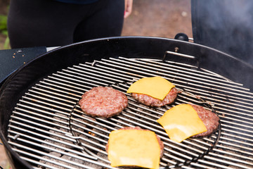 Making cheeseburgers.