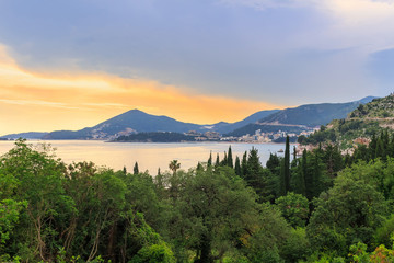 Fototapeta na wymiar Awesome colorful sunset on Adriatic sea coastline in Montenegro, gorgeous summer seascape and nature landscape