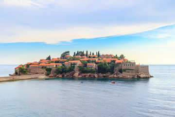 Fototapeta na wymiar Famous island Sveti Stefan in Adriatic sea at Montenegro, gorgeous summer seascape
