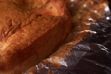 Tart with apricots on wooden table background close up