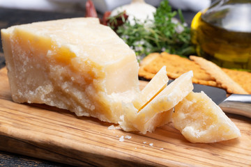 Traditional italian food - 36 months aged in caves Italian parmesan hard cheese from Parmigiano-Reggiano, Italy
