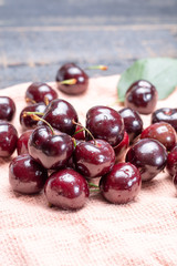 Giant fresh ripe black cherries, new harvest, ready to eat close up