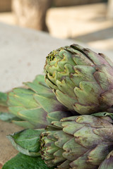 Obraz premium Traditional Italian food, fresh green artichoke vegetables, new harvest, uncooked
