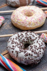 Children party background with sweet colorful donuts and candy