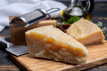 Traditional italian food - 36 months aged in caves Italian parmesan hard cheese from Parmigiano-Reggiano, Italy