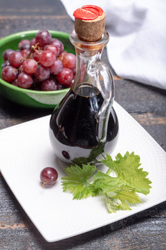 Black aged natural balsamic vinegar dressing from Modena, Italy