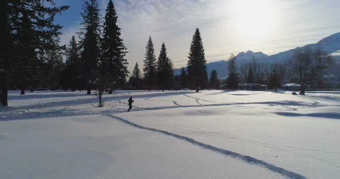 Woman jogging on snowy landscape 4k