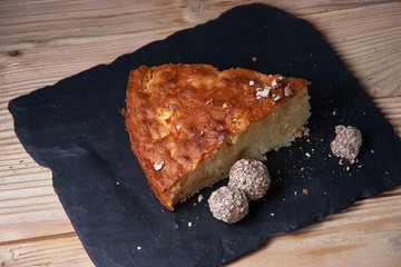 Delicious fresh baked piece of apple pie on shale board