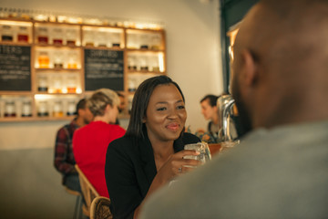 Smiling young woman enjoying a night out with her boyfriend