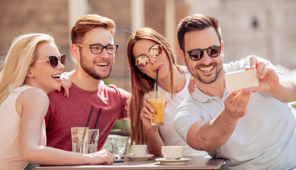 Friends having a great time in cafe