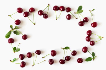 Cherry pattern. Ripe cherry berries and leaves isolated on white background. Berry summer background. Flat lay, top view, copy space 