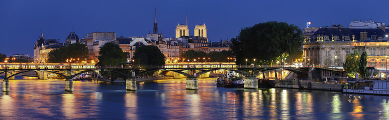 The night view of Seine river during the night with some famous touristic bridges like Pont des...