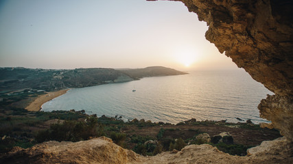 Scenic view of beautiful Ramla bay with beach and mediterranean sea from Calypso cave in Gozo, Malta