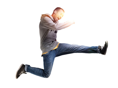 Portrait of an excited young man jumping in air against
