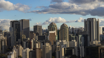 Fototapeta na wymiar Large buildings in the big city and a beautiful sunny sky, Brazil South America 