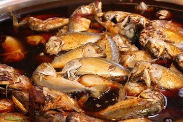 Boiled fish sauce at market