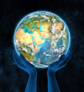 United Arab Emirates on planet Earth in hands