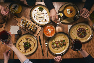 Table with food, top view. Group Of People Dining Concept