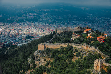 Alanya, Turkey. Wonderful country. At home from a height. Roofs of buildings. Antique Castle. View of the city. Foggy weather