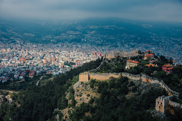 Alanya, Turkey. Wonderful country. At home from a height. Roofs of buildings. Antique Castle. View of the city. Foggy weather