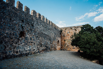 Alanya Kalesi. Brick ancient castle wall. Alanya, Turkey. Wonderful country. Ruins of the fortress of Alanya. Enter to the castle. Sunny day.