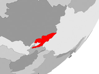 Fototapeta na wymiar Kyrgyzstan in red on grey map