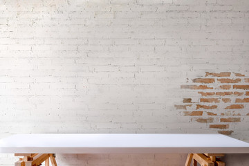 Empty white table and white brick wall background. - Powered by Adobe