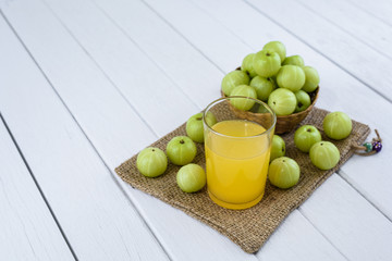 Indian gooseberry on wooden table