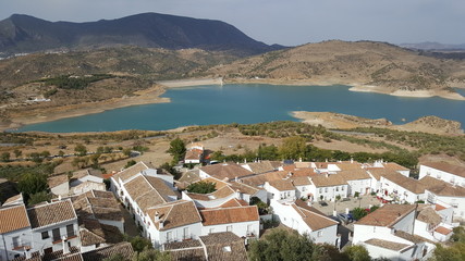 Aerial view of the Spanish town with lake  in the background