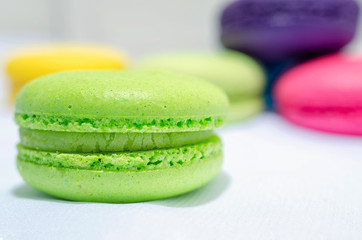 green macaroon macro on blurred background