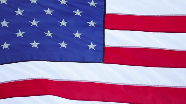 American Flag Slow Waving. Close up of American flag waving. Filmed at 60 fps and slowed down to 30 fps.