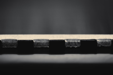 Detailed background of fragment of automotive radiator in macro with copy space. Monochrome image of metallic auto part is close-up. Empty surface of steel texture.