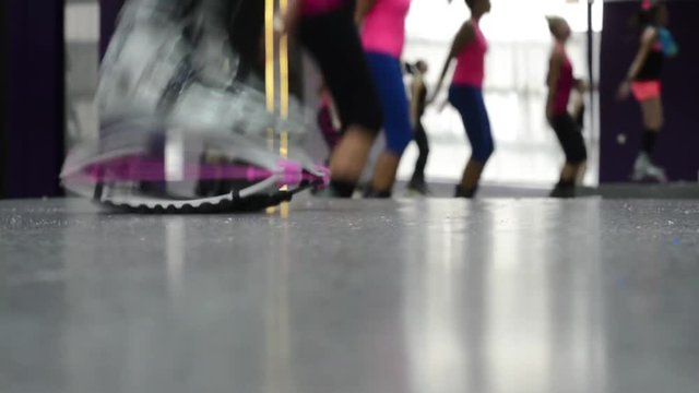 Ground view of Kangoo Shoes in use during a group fitness class.