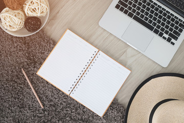 Mix of office supplies and gadgets on a wooden desk .