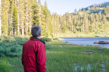 Man Looking at Beautiful Mountain Lake