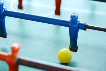 Soccer table game, blue foosball player.